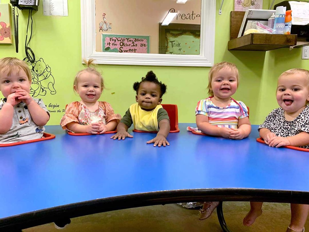 5 Babies Smiling Sitting at Snack Table